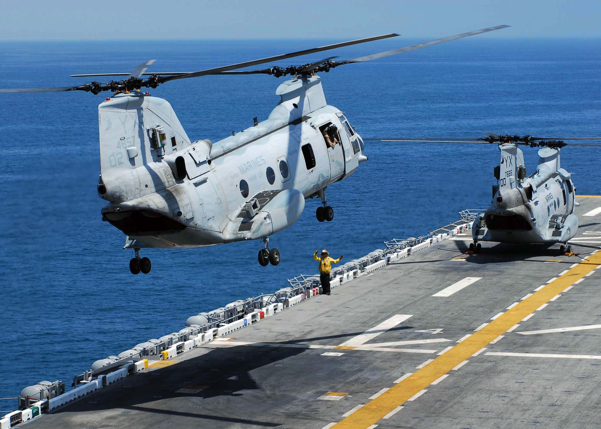 US Navy 090720-N-8607R-024 A CH-46E Sea Knight prepares to land on the flight deck of the amphibious assault ship USS Bonhomme Richard (LHD 6)