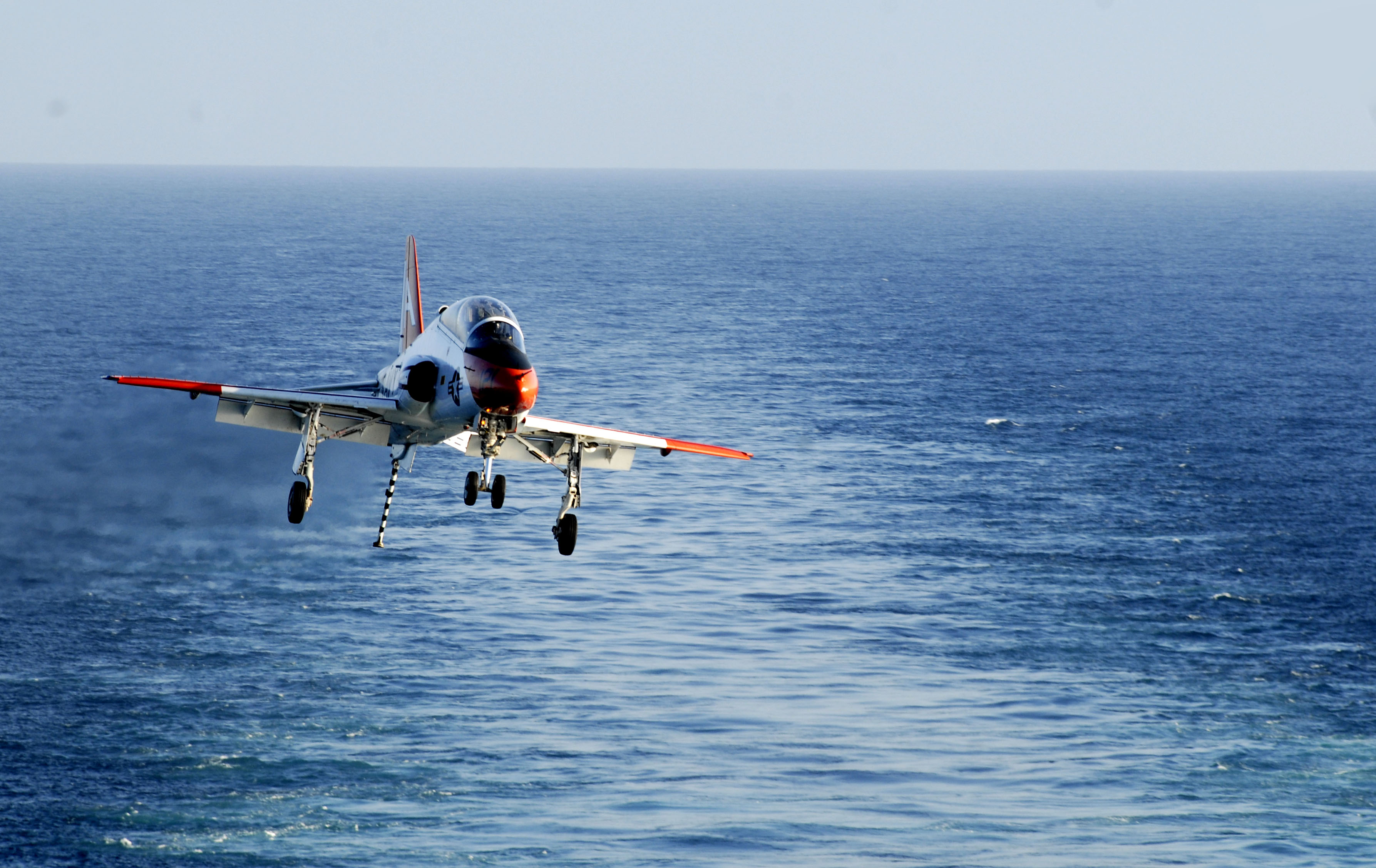 US Navy 100203-N-2475A-391 A T-45C Goshawk training aircraft assigned to Training Air Wing (TRAWING) 1 prepares to land aboard the Nimitz-class aircraft carrier USS John C. Stennis (CVN 74)