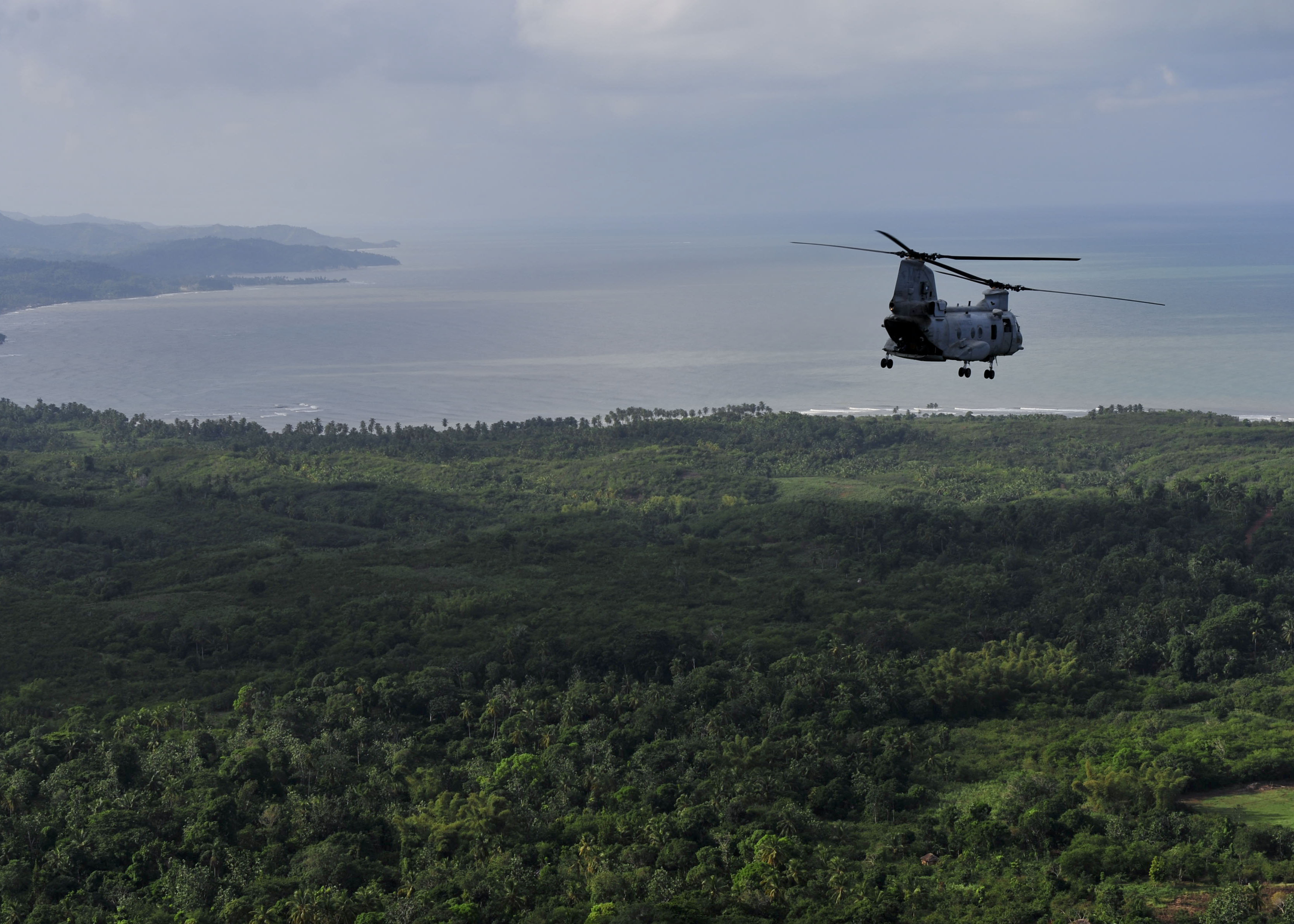 US Navy 101106-N-1531D-030 A CH-46E Sea Knight helicopter conducts aerial damage assessments of Haiti after Hurricane Tomas made landfall