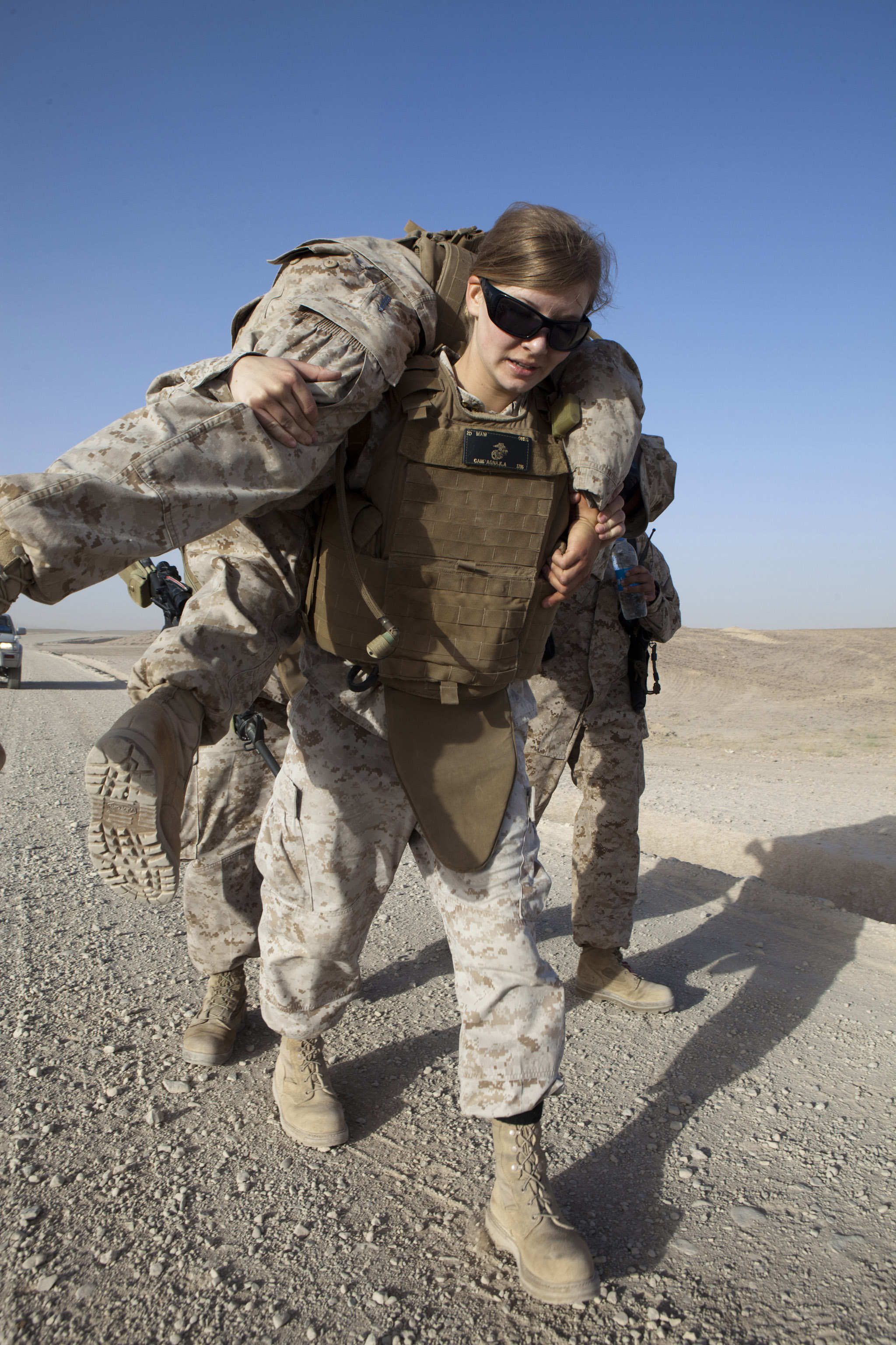 Defense.gov News Photo 110530-M-CL319-238 - U.S. Marine Corp Cpl. Kelly Campagna assigned to Marine Aviation Logistics Squadron 40 performs a fireman s carry with Cpl. Lance Rowewood during