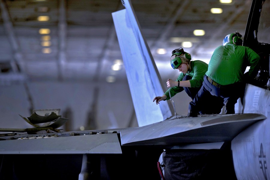 Defense.gov News Photo 110224-N-2055M-235 - U.S. Navy Petty Officer 3rd Class Jessica Murphy assigned to Strike Fighter Squadron 22 performs maintenance on an F A-18F Super Hornet aircraft