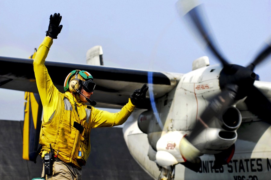 Defense.gov News Photo 110630-N-GL340-109 - U.S. Navy Lt. Jerrod Washburn signals the launch of a C-2A Greyhound from the aircraft carrier USS Ronald Reagan CVN 76 in the Arabian Sea on June