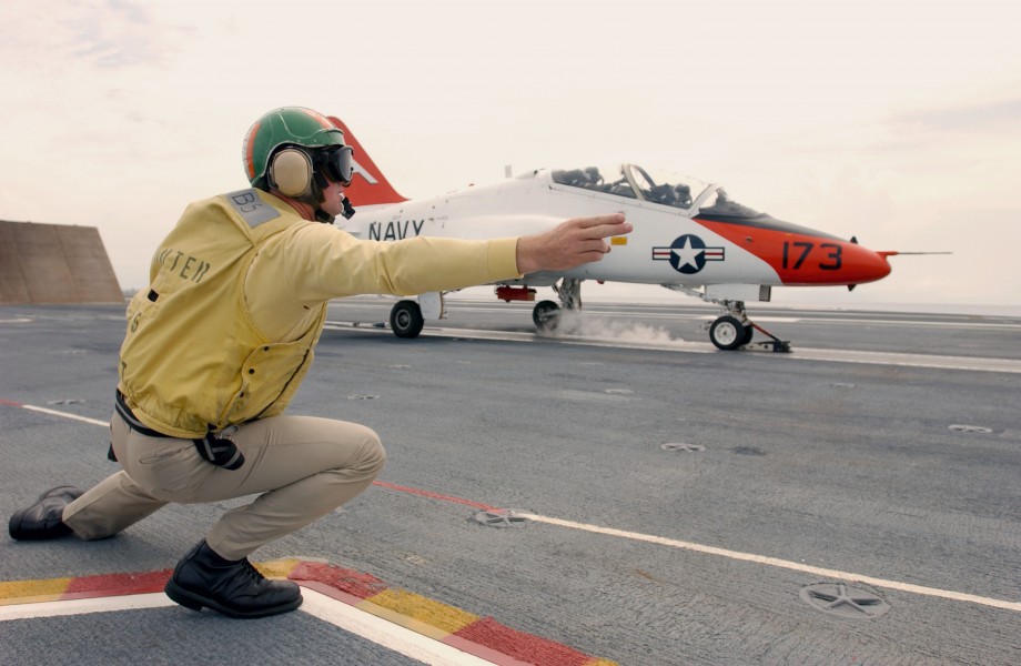 US Navy 030726-N-0696M-014 Lt. Benjamin VanBuskirk gives the signal to launch a T-45 Goshawk