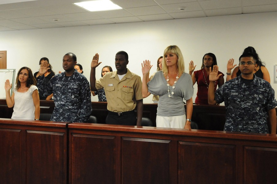 US Navy 100720-N-1938G-002 Candidates for U.S. citizenship recite the oath of citizenship during a naturalization ceremony at Naval Air Station Sigonella