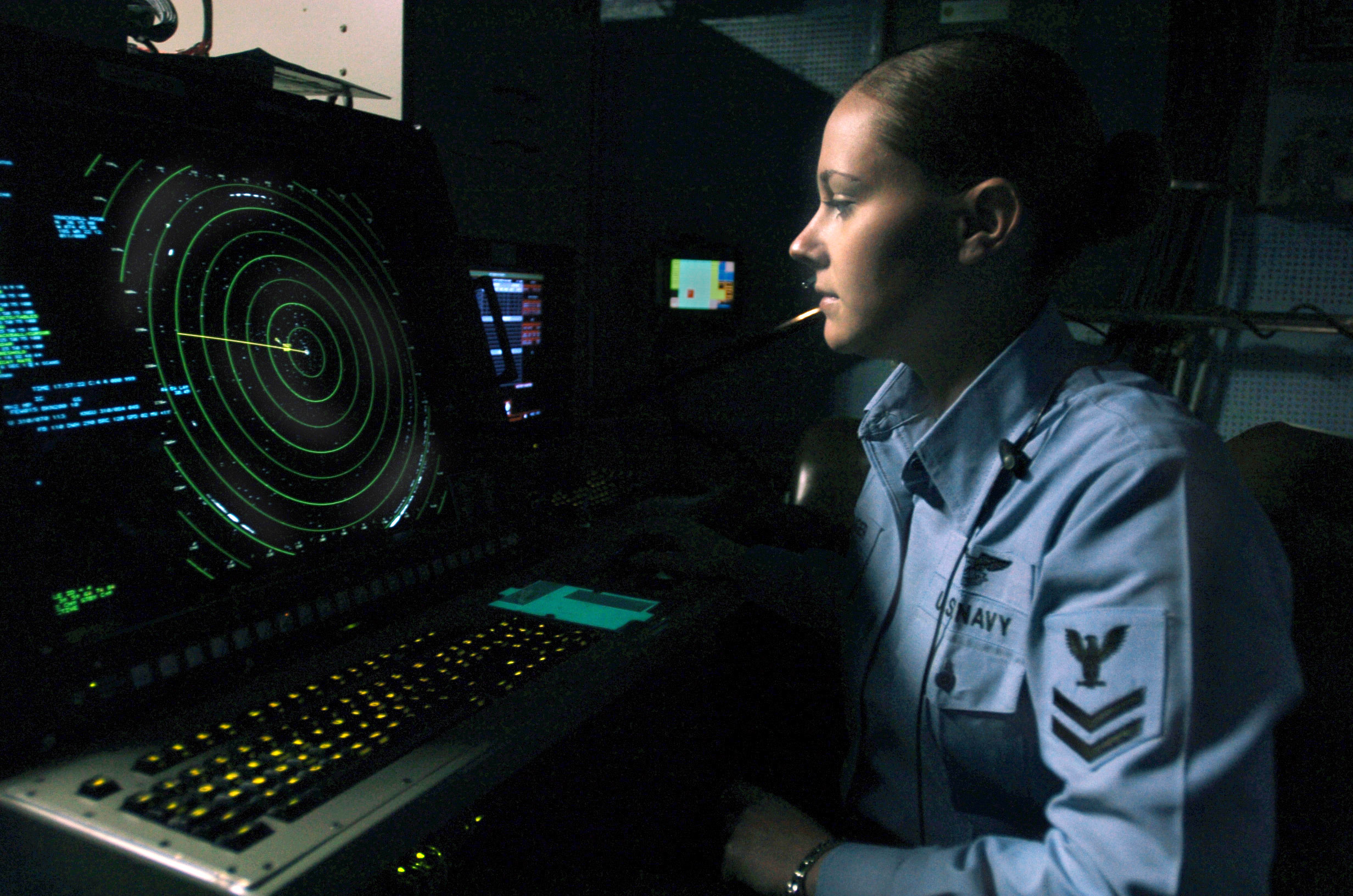 US Navy 061209-N-5248R-001 Air Traffic Controller 2nd Class Emmily Trolinger from Farmington, Mo., stands watch as aircraft departure controller in Carrier Air Traffic Control Center