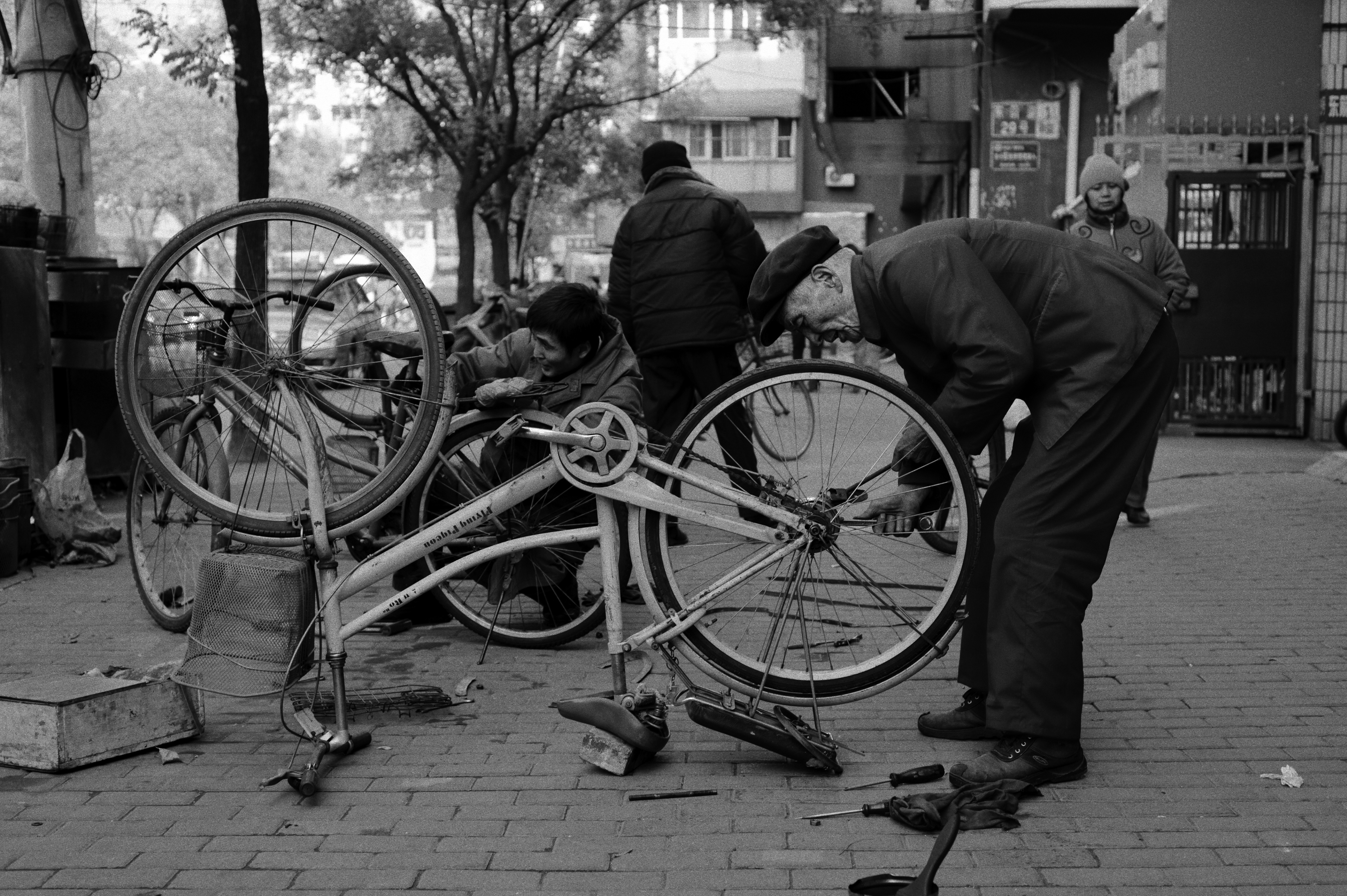 A man repairs a bike