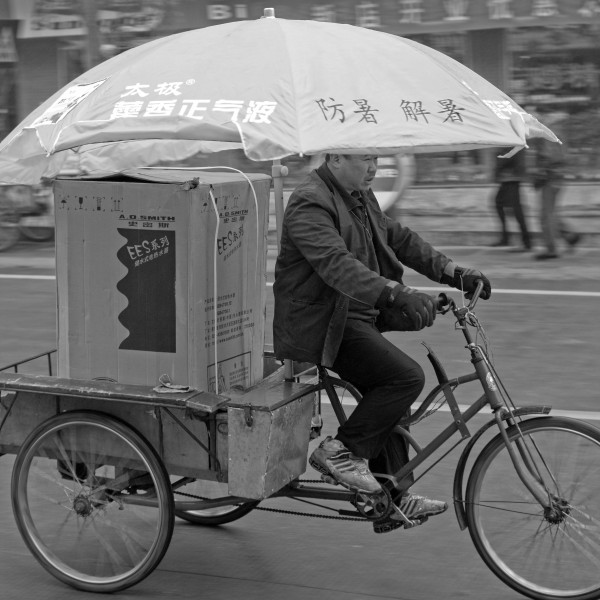 Big umbrella on a tricycle