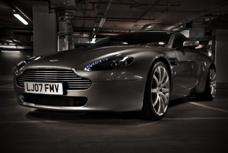 A silver Aston Martin V8 Vantage coupé, photographed using the HDR technique.