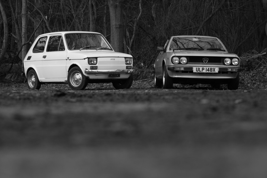 White left hand drive Fiat 126 produced in 1973 and Lancia Beta Coupé