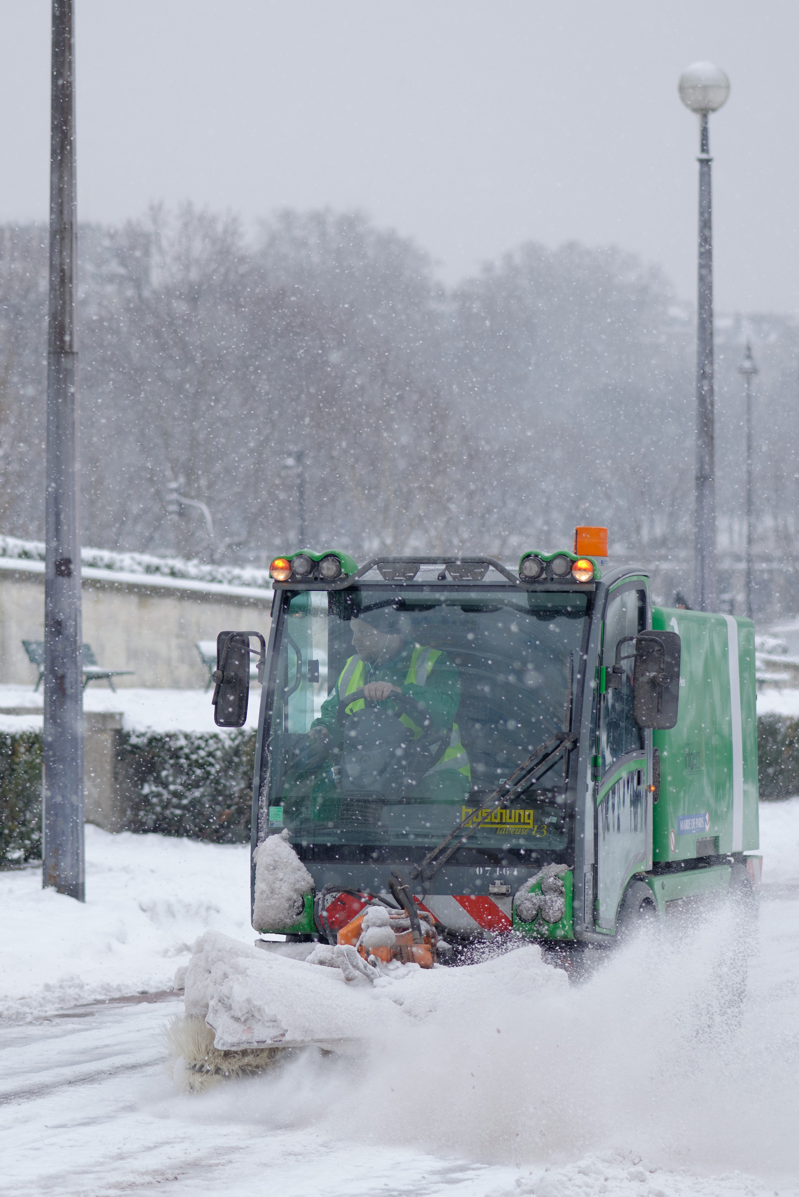 Road sweeper clearing snow away in Paris