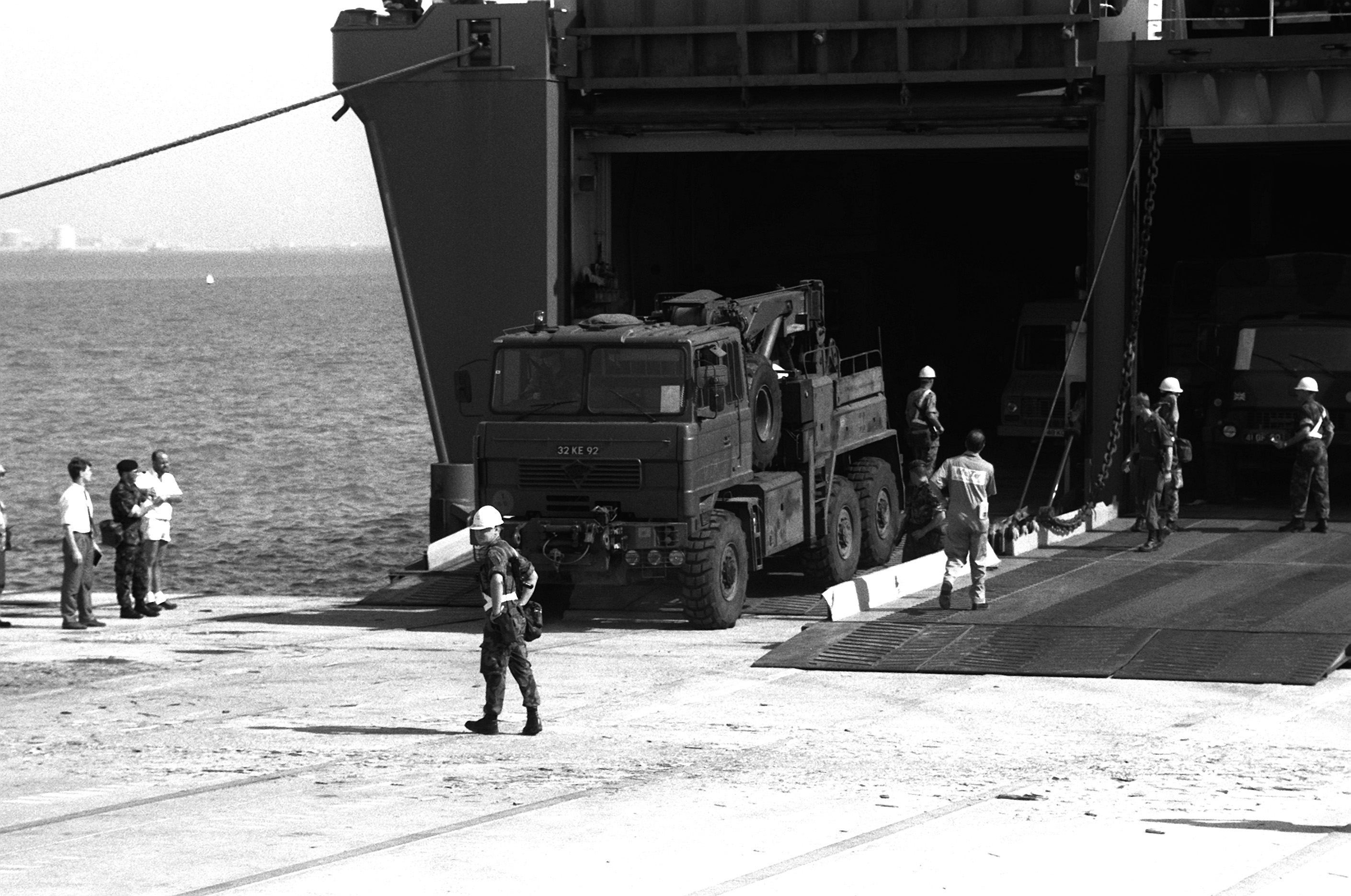 A British Foden 6x6 recovery vehicle leaves the Danish cargo ship Dana Cimbria during Operation Desert Shield