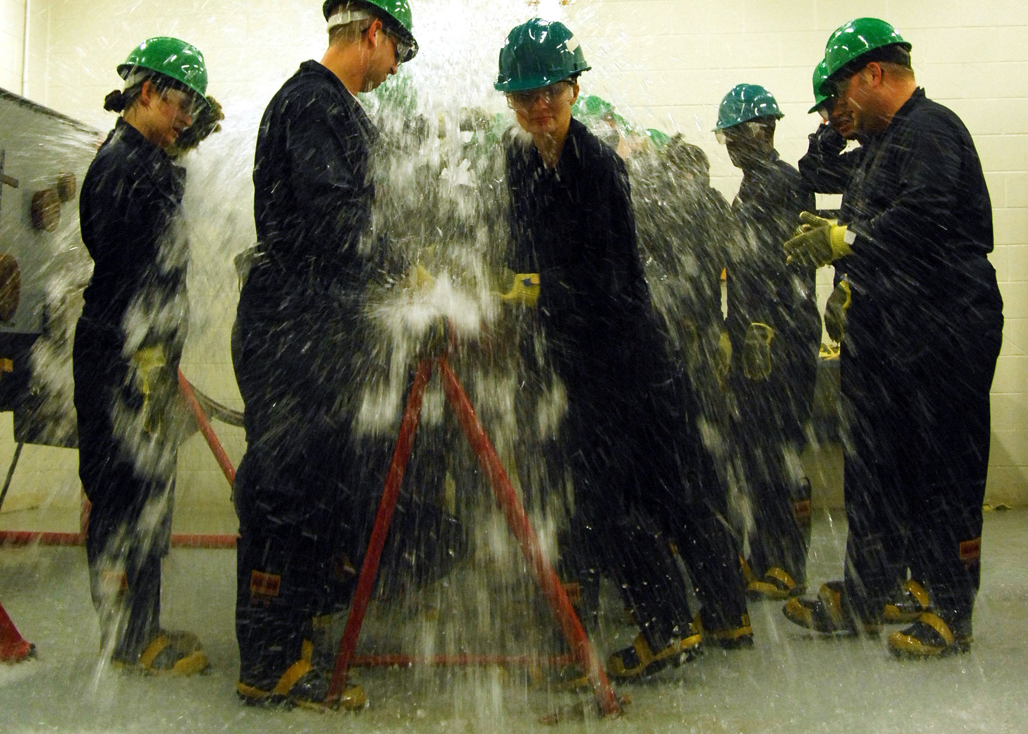 Defense.gov News Photo 110715-N-YC845-428 - First class petty officers from Naval Support Activity Norfolk commands train at the Farrier Firefighting School damage control wet trainer USS