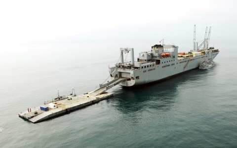 The USNS Pililaau sits anchored off the Pacific coast at Camp Pendleton, Calif., July 22, during Joint Logistics Over The Shore 2008. JLOTS is an annual exercise that increases the Army's and Navy's ability to build improvised ports for transporting equipment from ship to shore when a harbor or pier has been damaged or is nonexistent. Nearly 1,500 pieces of rolling equipment and shipping containers will be moved from ships with a series of lighterage systems (floating roadways) and smaller boats to improvised piers on the shore. (U.S. Army photo by Sgt. Stephen Proctor, JLOTS Public Affairs)