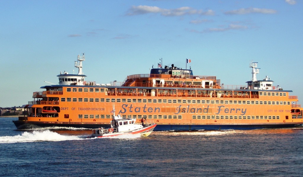 Coast Guard patrol boat passes a Staten Island Ferry boat