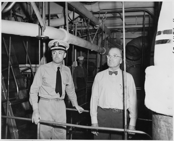 Lt. Commander N. V. King, Engineering Officer, conducts President Harry S. Truman through the engine room on a tour... - NARA - 198733