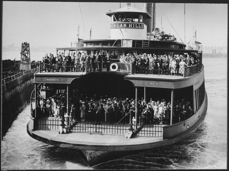The ferryboat Dongan Hills, filled with commuters, about to dock at a New York City pier, ca. 1945 - NARA - 541821