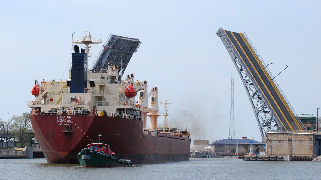 The Yucatan enters harbour in Lorain, Ohio with the assistance of the tug Iowa