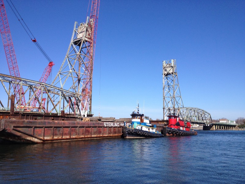 Tugboats and a barge working on the deconstruction of the Memorial Bridge, Portsmouth, NH
