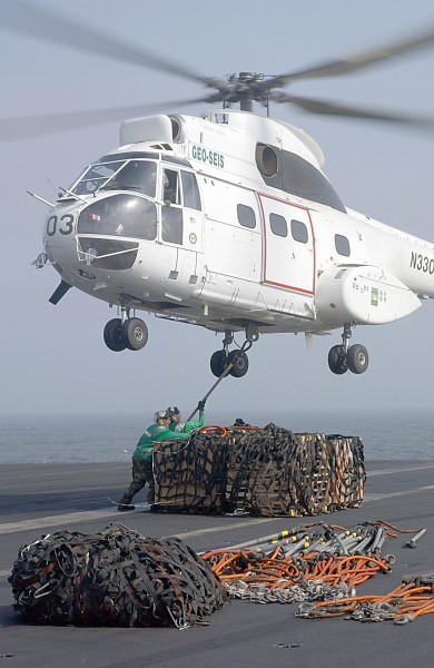 US Navy 020729-N-2329T-002 Sailors attach a Cargo Net to a Puma Helicopter