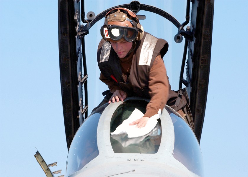 US Navy 021112-N-9593M-045 Aviation Electrician's Mate cleans the front canopy on an F-14D