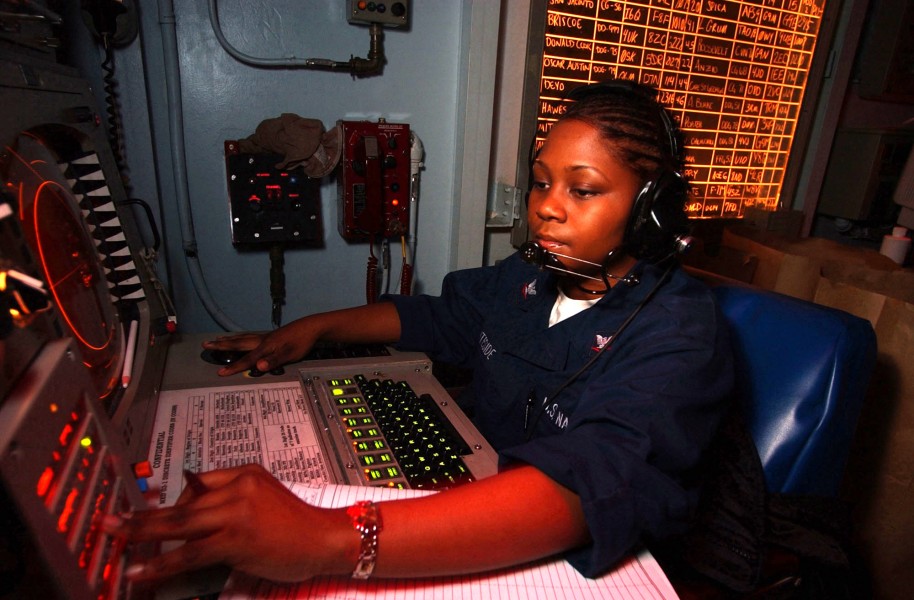 US Navy 030214-N-1350S-011 Operations Specialist 3rd Class Natasha Whiteside tracks contacts in the Tactical Operations Plot room