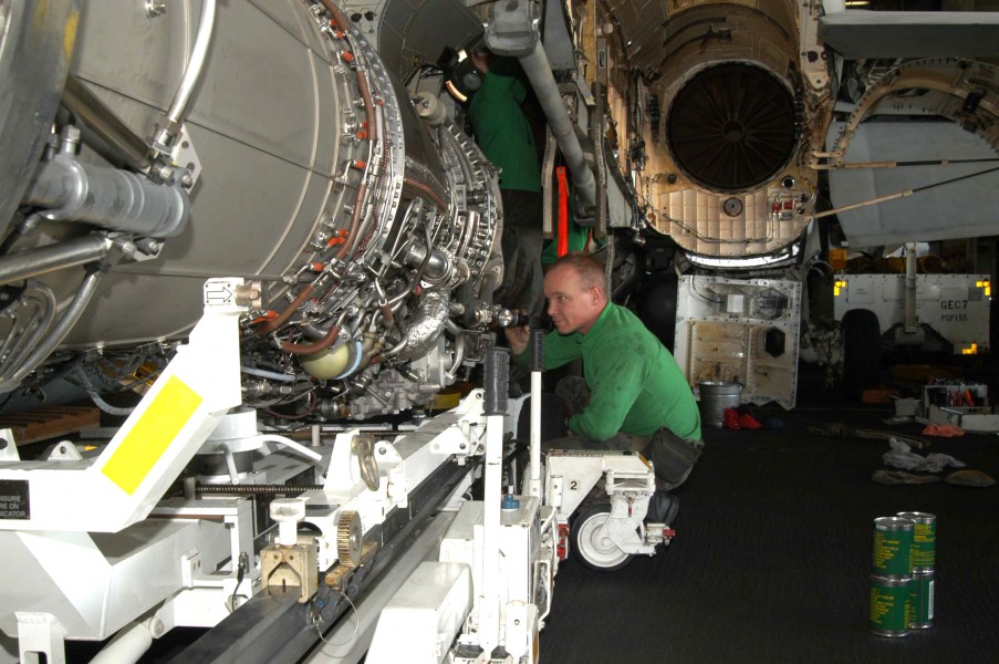 US Navy 030303-N-9228K-012 Super Hornet maintenance in ship's hangar bay