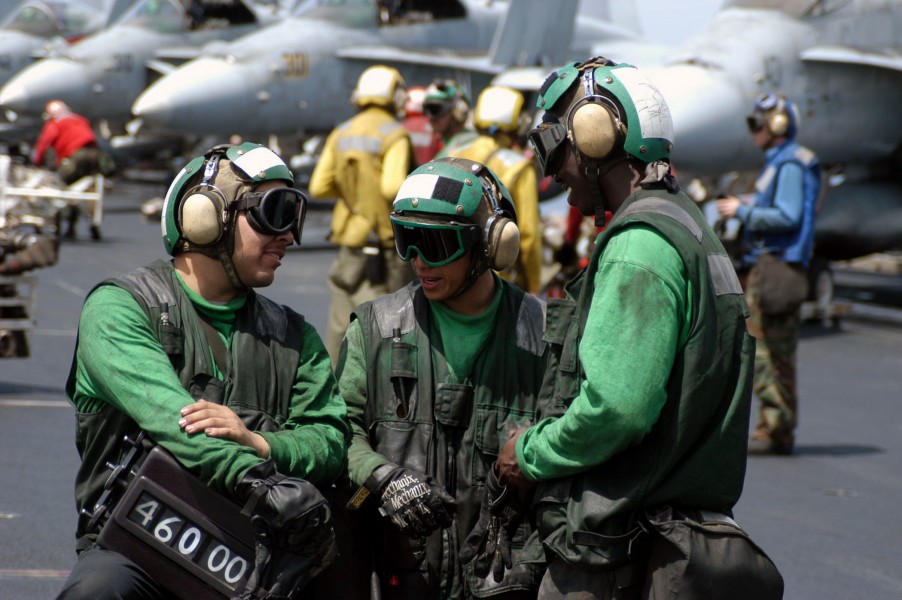 US Navy 030404-N-1159M-062 The Catapult crew from Air Department^rsquo,s V-2 Division discusses the next launch-cycle during a break in flight operations aboard USS Abraham Lincoln (CVN 72)