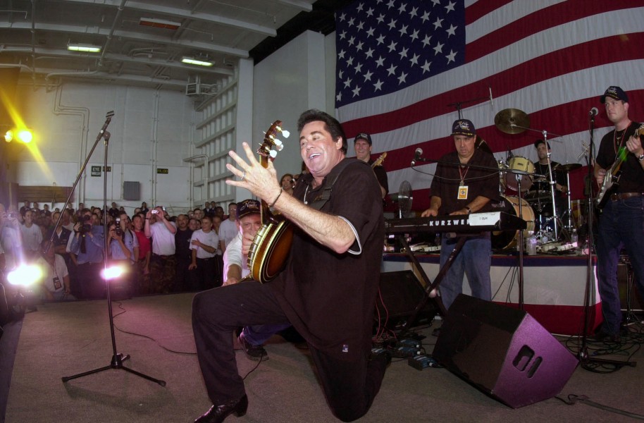 US Navy 030619-N-7027P-002 Actor-Entertainer Wayne Newton from Las Vegas, Nev., performs for the crewmembers during a United Services Organization (USO) show aboard USS Nimitz (CVN 68)