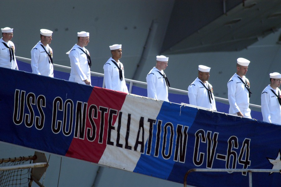 US Navy 030807-N-1397H-003 Sailors depart USS Constellation (CV 64) during the ships decommissioning ceremony