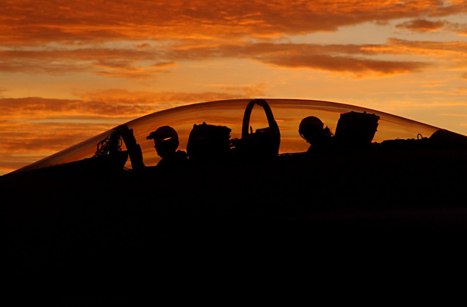 US Navy 030812-N-9769P-082 Silhouetted by a setting sun, the aircrew of an F-A-18F Super Hornet assigned to the 