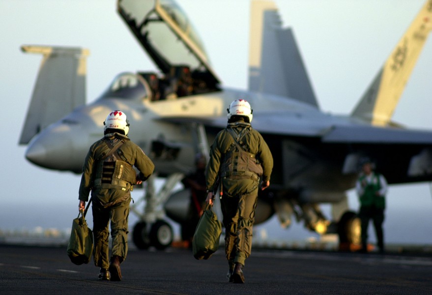US Navy 030813-N-6213R-188 Naval aviators assigned to the Diamondbacks of Strike Fighter Squadron One Zero Two (VFA-102) walk toward an F-A-18F Super Hornet