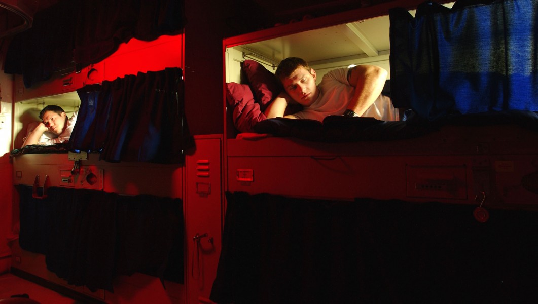 US Navy 031112-N-9769P-020 Sailors relax in their bunks
