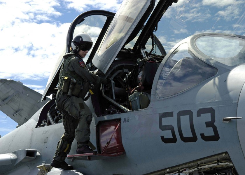 US Navy 041026-N-0499M-024 An Electronic Countermeasures Officer (ECMO) climbs into her EA-6B Prowler assigned to the Lancers of Electronic Attack Squadron One Three One (VAQ-131)