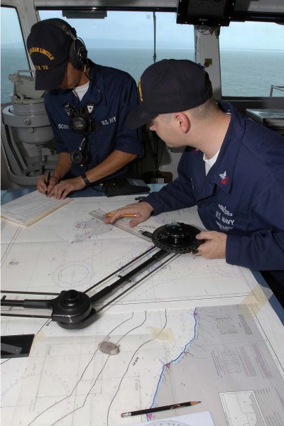 US Navy 050101-N-6074Y-042 Crew members plot the ships course for USS Abraham Lincoln (CVN-72) as she transits the waters off of the coast of Banda Aceh, Sumatra, Indonesia