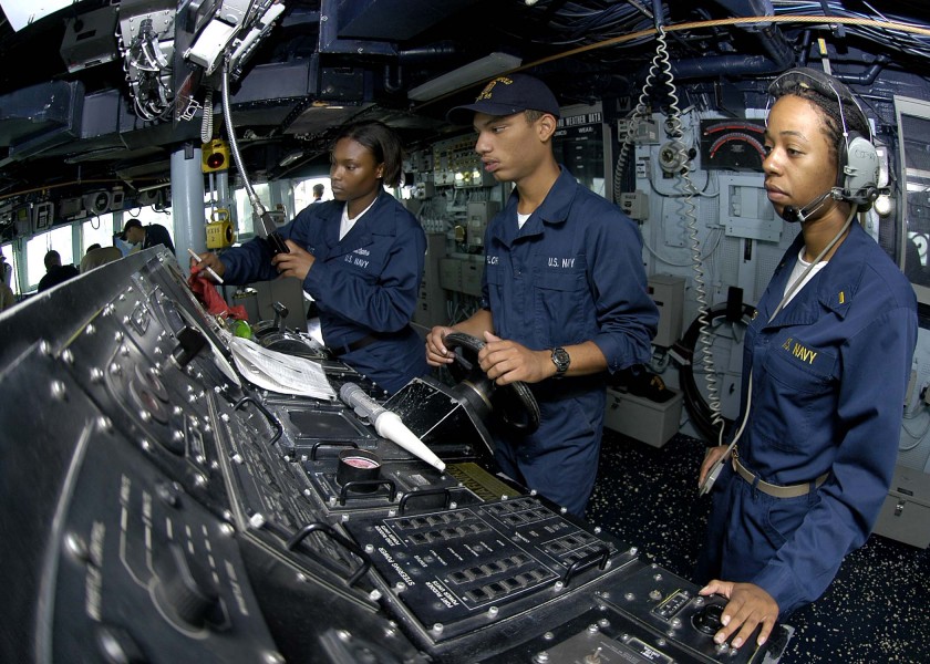 US Navy 050102-N-9079D-423 Seaman Ashley August, left, Seaman Joan Flores, center and Ens. Lori Boles stands watch on the bridge aboard the guided missile destroyer USS Benfold (DDG 65)