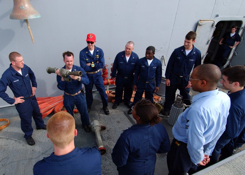 US Navy 050503-N-5526M-001 Chief Damage Controlman Sean Mahoney from Phoenix, Ariz., assigned to the Ticonderoga-class guided missile cruiser USS Normandy (CG 60), gives repair locker training