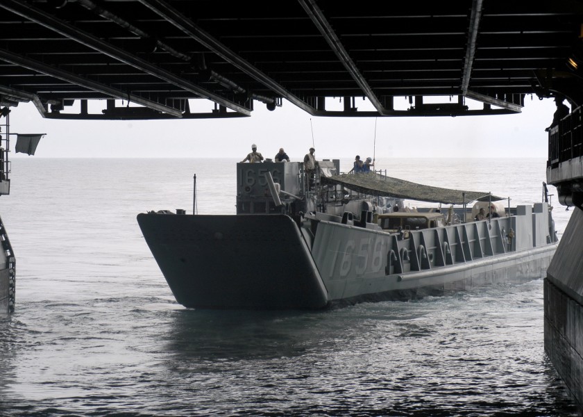 US Navy 050831-N-1467R-024 A Landing Craft, Utility (LCU) assigned Assault Craft Unit Two (ACU-2), departs the well deck of the amphibious assault ship USS Bataan (LHD 5) bound for New Orleans