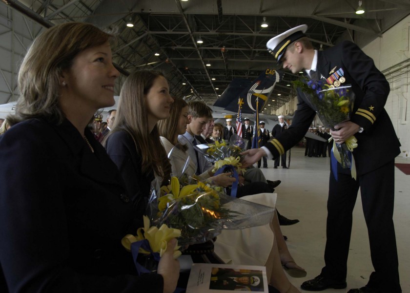 US Navy 060224-N-6060O-166 Capt. Lawrence D. Burt's Family members receive flowers during the change of command ceremony for Carrier Air Wing Two (CVW-2) on board Naval Air Station Lemoore