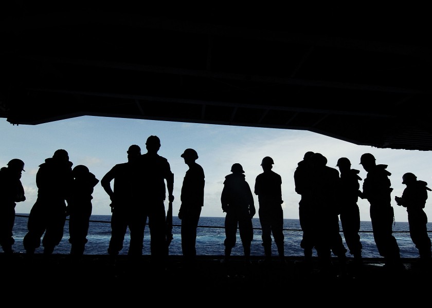 US Navy 060629-N-0499M-012 Boatswain's Mates stand ready for an underway replenishment aboard the Nimitz class aircraft carrier USS Abraham Lincoln (CVN 72)