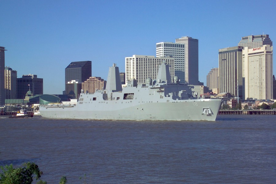 US Navy 061023-N-0857S-003 The Pre-Commissioning Unit New Orleans (LPD 18) transits past the city of New Orleans on the Mississippi River