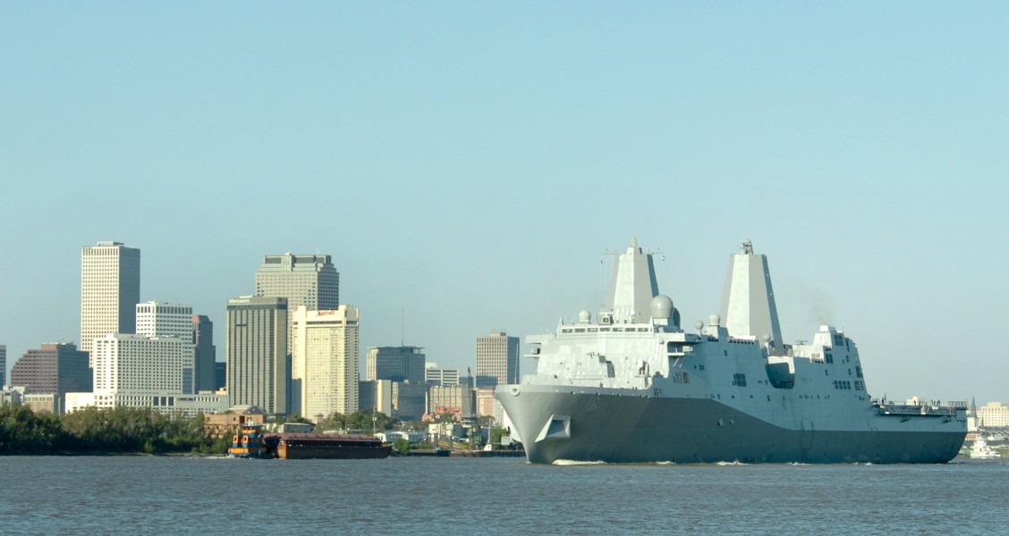 US Navy 061023-N-9995B-002 The Pre-Commissioning Unit New Orleans (LPD 18) transits past the city of New Orleans on the Mississippi River