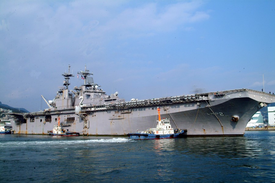 US Navy 061201-N-4124C-001 USS Essex (LHD 2) is pushed by tugs into her berth