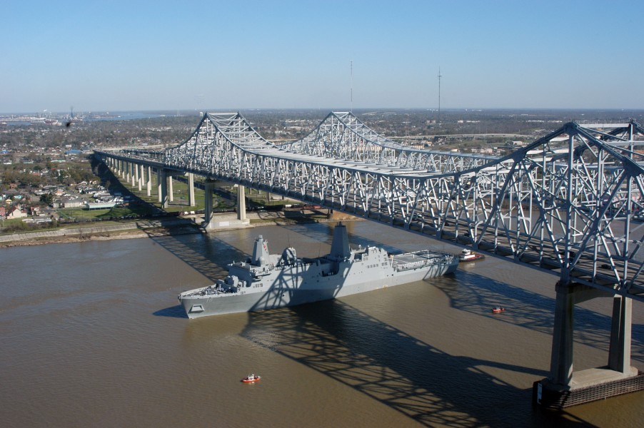 US Navy 070305-N-3429E-003 Pre-Commissioning Unit New Orleans (LPD 18) transits under the Crescent City Connection Bridge, up the Mississippi River, toward her namesake city
