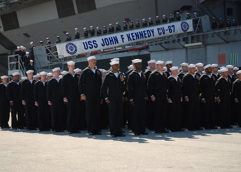 US Navy 070323-N-4565G-011 The Sailors of USS John F Kennedy (CV 67) disembark the ship near the end of the ship^rsquo,s decommissioning ceremony