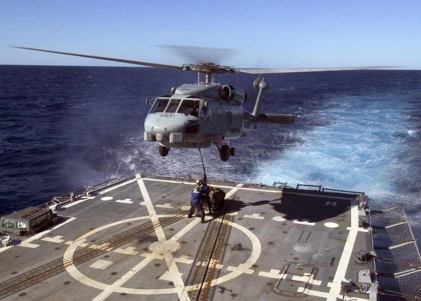 US Navy 070430-N-5253W-005 Sailors aboard the Arleigh burke-class guided-missile destroyer USS Lassen (DDG 82) connect a pallet to an SH-60B helicopter