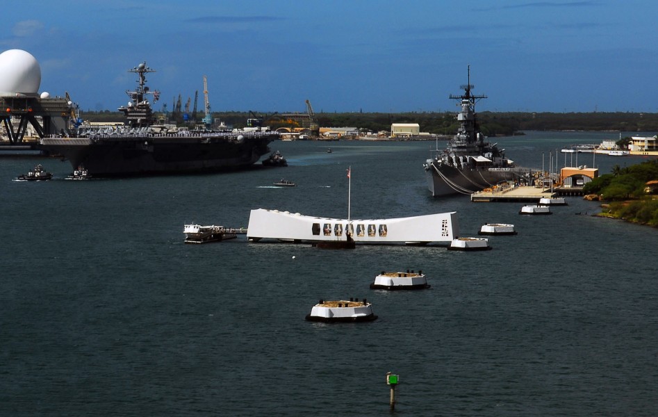 US Navy 070820-N-0684R-384 Sailors and Marines stand at attention while manning the rails as Nimitz-class aircraft carrier USS John C. Stennis (CVN 74) passes the USS Arizona Memorial