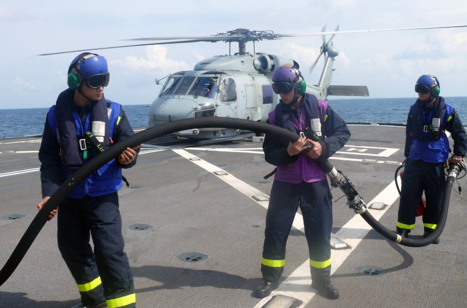 US Navy 080626-N-7109S-189 Flight deck crew members assigned to the Republic of Singapore Navy frigate RSS Tenacious perform a hot pump refueling