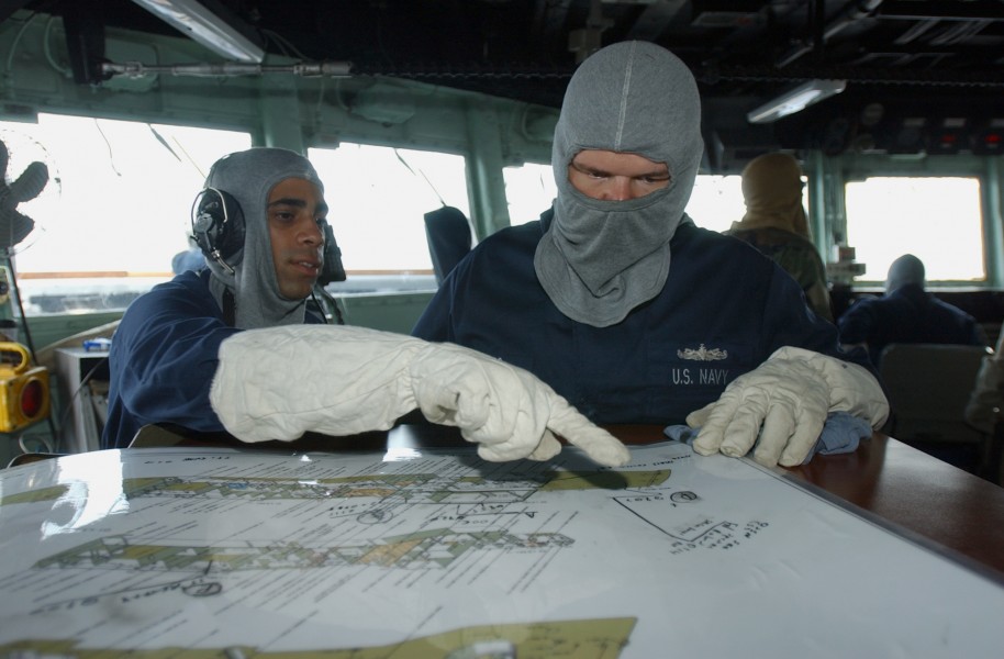 US Navy 080628-N-8943B-024 Quartermaster 3rd Class Sameer Momaiya, left, and Boatswain's Mate 2nd Class Jason Hibbs track damage reports aboard the guided-missile frigate USS Simpson (FFG 56)