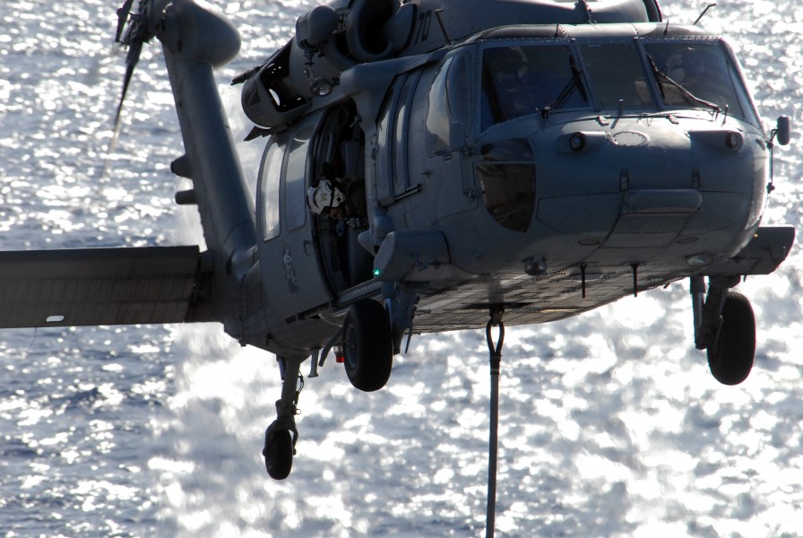 US Navy 080710-N-1635S-006 An aircrewman aboard an MH-60S Seahawk assigned to the 
