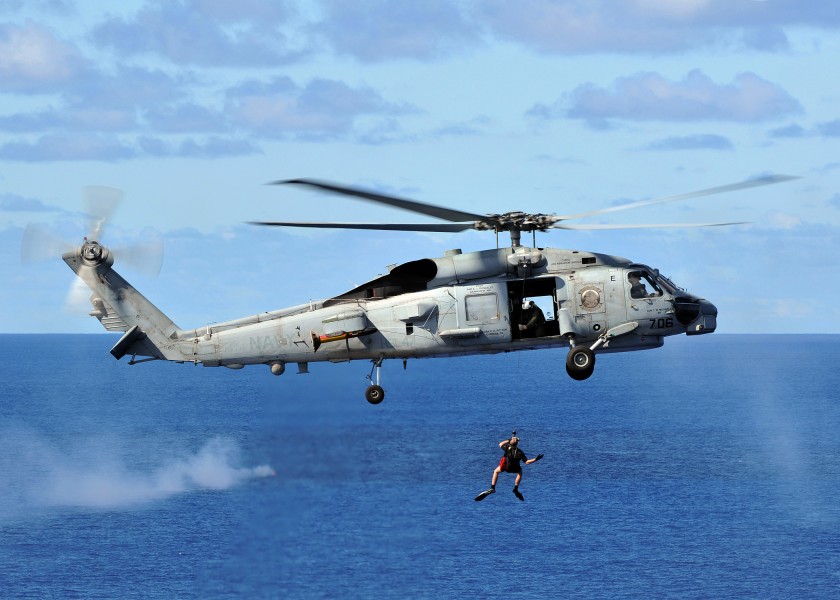 US Navy 080929-N-7981E-498 A rescue swimmer is hoisted back into an SH-60B Sea Hawk helicopter assigned to the 